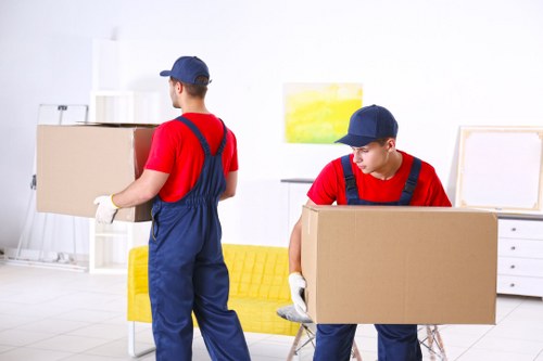 Local removals team handling a Shoreditch move on a busy East London street