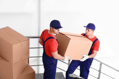 Removal team loading furniture in Shoreditch on a busy East London street