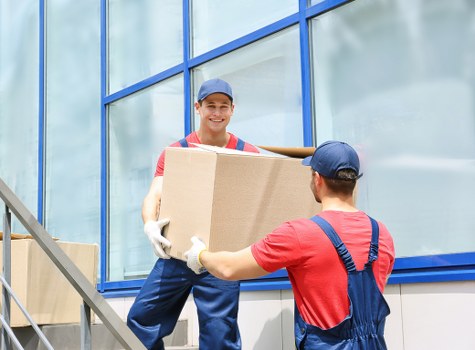 Moving crew checking a property route for safety hazards