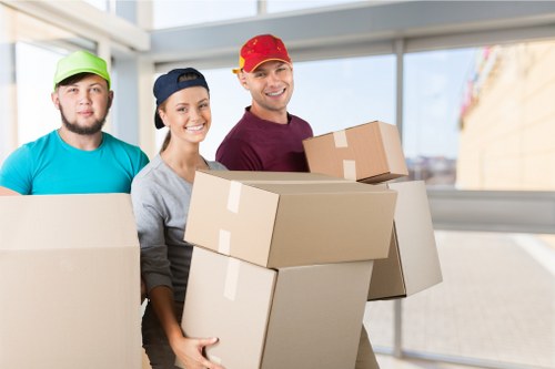 Removal team helping with a home move in Shoreditch street setting