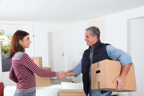 Professional movers loading items for a same day relocation