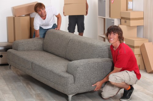 Careful loading of household items for a move near Shoreditch High Street