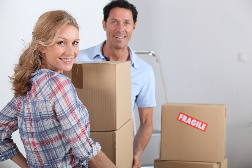 Professional movers transporting office furniture in Shoreditch